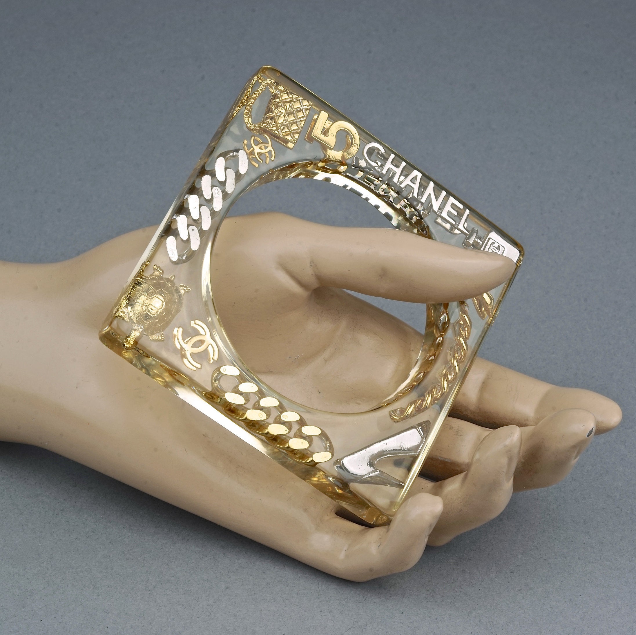 Vintage 1997 CHANEL Iconic Charms Lucite Plexi Square Bangle Vintage 1997 CHANEL Iconic Charms Lucite Plexi Square Bangle