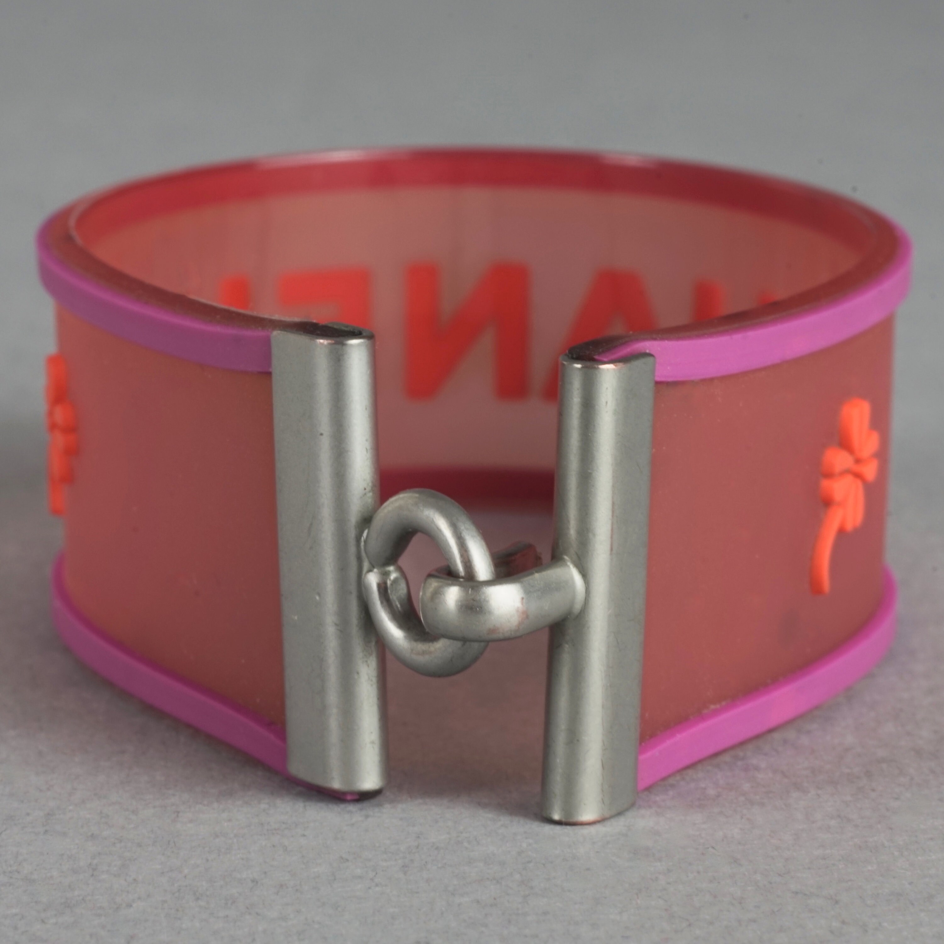 Vintage 2001 CHANEL Logo Camellia Pink Orange Rubber Cuff Vintage 2001 CHANEL Logo Camellia Pink Orange Rubber Cuff