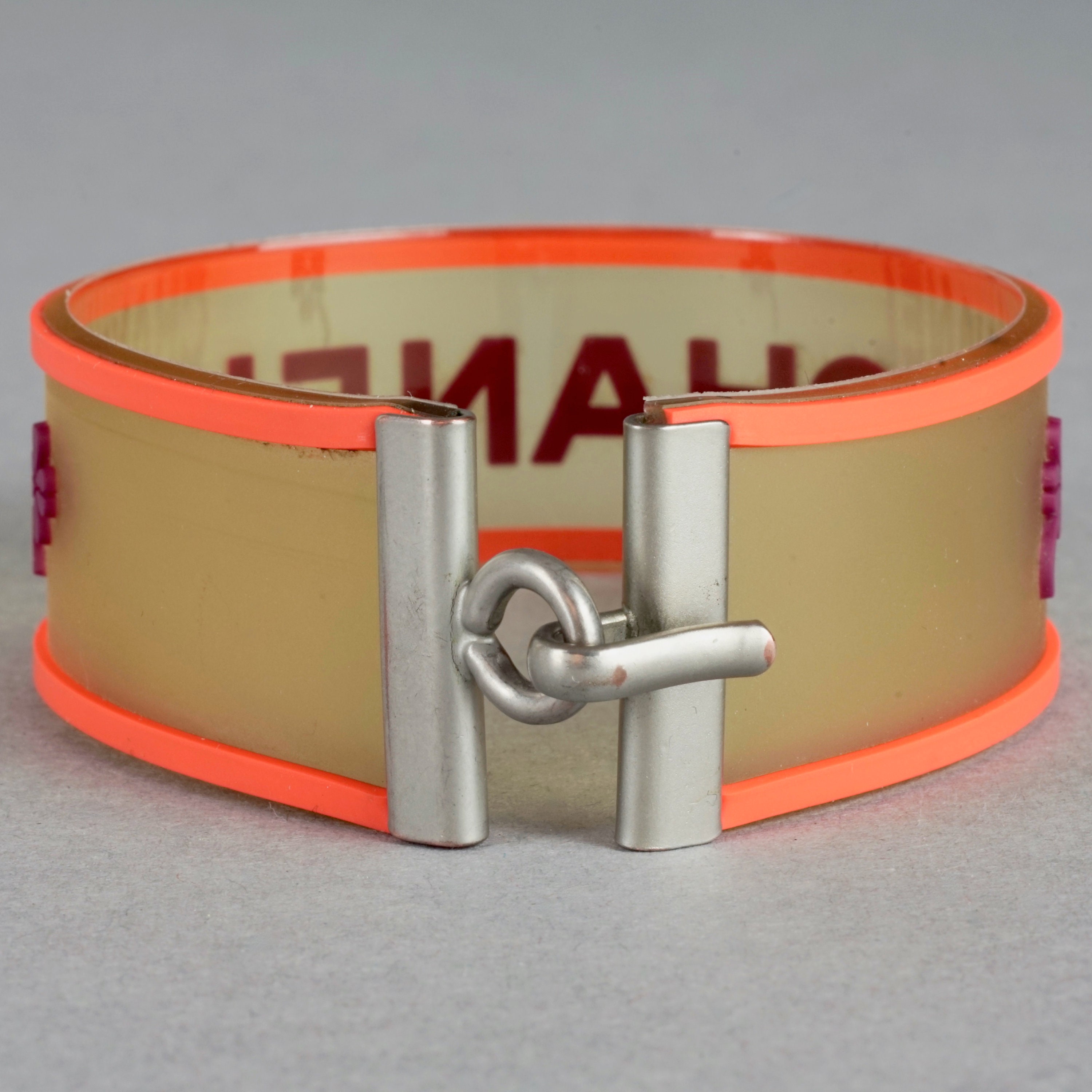 Vintage 2001 CHANEL Logo Camellia Orange Violet Rubber Cuff Vintage 2001 CHANEL Logo Camellia Orange Violet Rubber Cuff