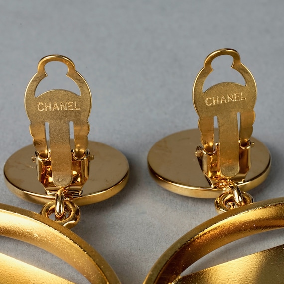 Vintage CHANEL earrings with golden CC, faux pearl, black leather