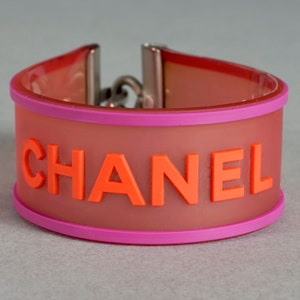 Vintage 2001 CHANEL Logo Camellia Pink Orange Rubber Cuff Bracelet