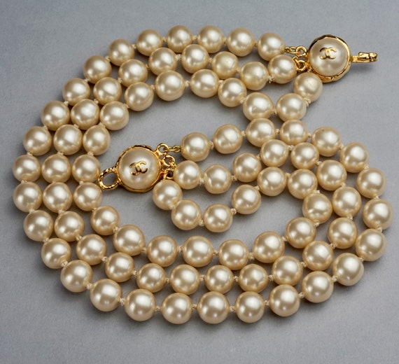 Sold at Auction: 8 mm round cream color faux pearl gold tone clasp knotted  necklace, 24 1/2 inches, Japan