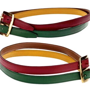 Pode incluir: Um cinto de couro multicolorido com uma fivela dourada. O cinto &eacute; feito de quatro camadas de couro em verde, vermelho, amarelo e marrom.