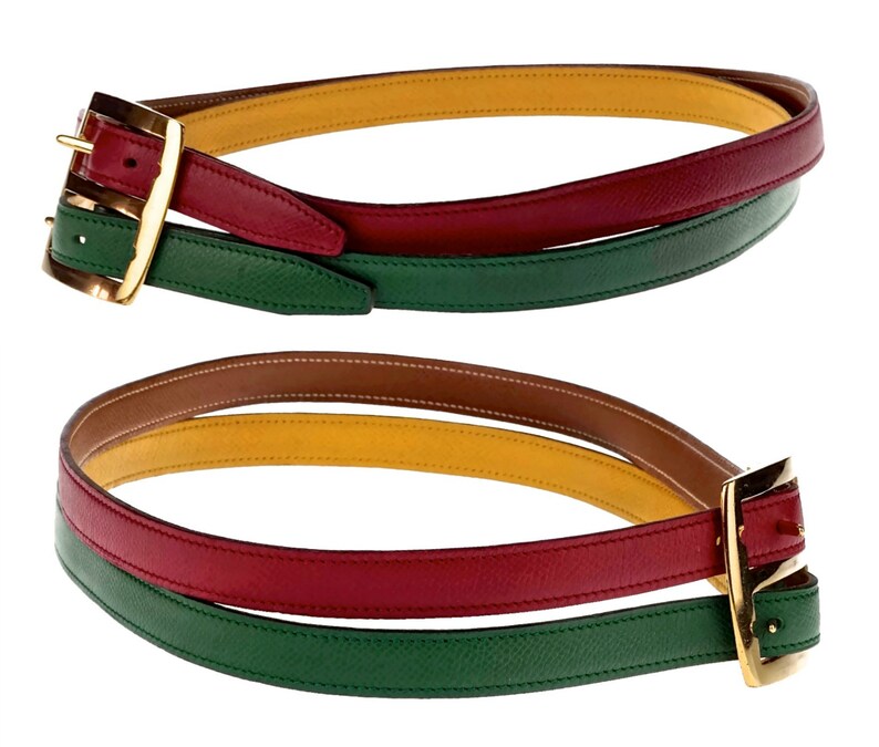 Pode incluir: Um cinto de couro multicolorido com uma fivela dourada. O cinto &eacute; feito de quatro camadas de couro em verde, vermelho, amarelo e marrom.