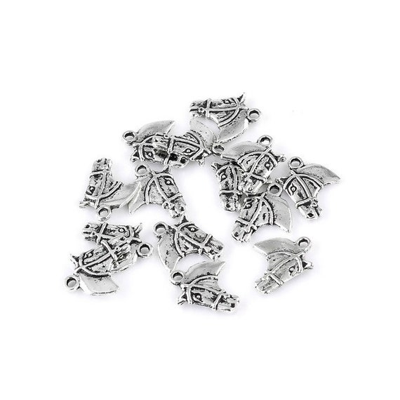 4 Horse charms antique silver tone A13