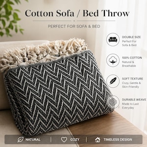 May include: A folded black and white cotton sofa/bed throw with a chevron pattern and cream-colored fringe. The throw is labeled "Cotton Sofa / Bed Throw" and "Perfect for Sofa & Bed". It is described as double size, 100% cotton, soft texture, and durable weave.