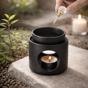 Quemador de aceite de cerámica negra, calentador de cera minimalista para un hogar acogedor y relajante.