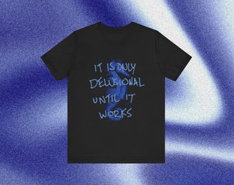 It’s Only Delusional Until It Works Tee | Motivational Streetwear Shirt | Vintage Blue Script Graphic