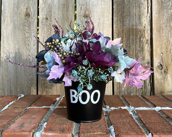 Halloween Arrangement featuring Cream, Teal, and Purple Flowers