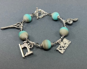 Sewing Charm Bracelet with textured Aqua and Grey Striped Beads and Swarovski