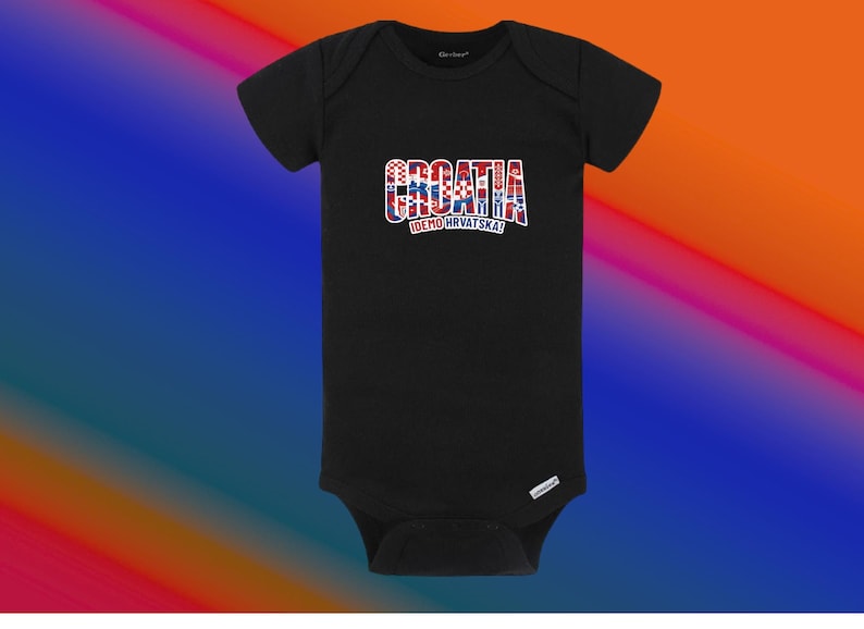 May include: Black baby bodysuit with the word "CROATIA" in red, white, and blue, with the Croatian flag colors. Below the word "CROATIA" is the text "IDEMO HRVATSKA!" in white. The bodysuit is made of soft material.