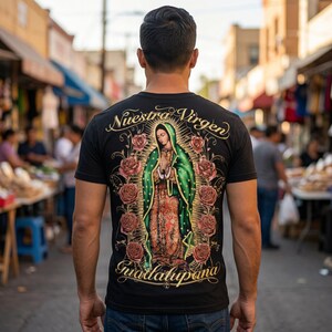 May include: Black t-shirt featuring a detailed graphic of Our Lady of Guadalupe, surrounded by roses, with the text "Nuestra Virgen Guadalupana" in gold script. The image is on the back of the shirt.