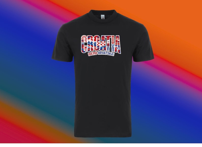 May include: Black crew neck t-shirt with the word "CROATIA" in a red, white, and blue design, with the text "IDEMO HRVATSKA!" below. The shirt is a solid black color.