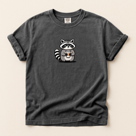 Sleepy Raccoon Coffee Shirt, Cozy Animal Tee, Funny Introvert Coffee Lover T-Shirt Comfort Colors®