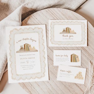 May include: A set of baby shower stationery featuring a scalloped border and watercolor illustrations of a teddy bear, books, and alphabet blocks. The text includes 'a new chapter begins', 'thank you', 'books for baby', and 'diaper raffle' details.