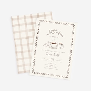May include: A baby shower invitation with a cream background and a scalloped border. The text "a little bean is brewing!" is at the top, with illustrations of a croissant, coffee cup, and baby socks. The invitation includes the name Olivia Smith, date, time, and location.