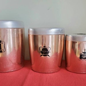 Mid century West Bend Copper Aluminum Canister Set