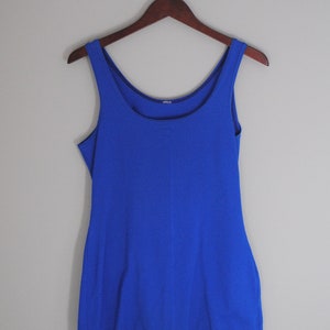 May include: A royal blue sleeveless swimsuit with a scoop neck.