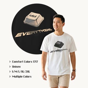 May include: White t-shirt with a graphic of a black "ctrl" key and the word "EVERYTHING" in a stylized font. A larger version of the graphic is on a black circle in the background. The shirt is unisex and available in multiple colors.