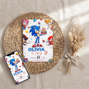 May include: A rectangular birthday invitation card and a smartphone displaying the same design, featuring Sonic the Hedgehog characters, a birthday cake, and the text: OLIVIA Is Turning 10, June 27, SATURDAY at 12:45, Wycombe Leisure Centre.
