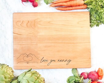 Love You Nanny, Personalized Cutting Board with Heart Hands. Mother's Day Gift can be Customized with Any Name.