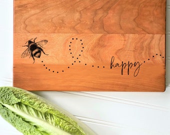 Be Happy. (BEE Happy). Cutting Board with buzzing bee, by Milk & Honey. Engraved Cheese Board for inspirational kitchen gift milk and honey