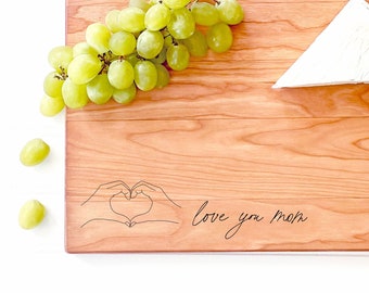 Love You Mom Cutting Board with Line Heart Hands for Mother's Day. Can be Personalized with Any Name for Custom Mothers Day Gift