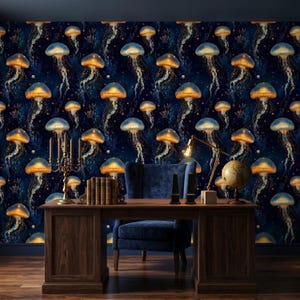 May include: A dark blue wall with a repeating pattern of jellyfish with orange and blue caps. A wooden desk with a blue chair, books, a globe, and a candelabra are in front of the wall. A gold desk lamp is on the desk.