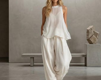 Elegant two-piece set sheer tank  wide-leg pants. Breathable, minimalist style perfect for resort vacations and effortless summer chic.