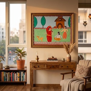 May include: A room interior with a framed painting depicting figures in traditional dress, positioned above a wooden console table. The space includes a bookshelf, a patterned rug, and an armchair with a throw.