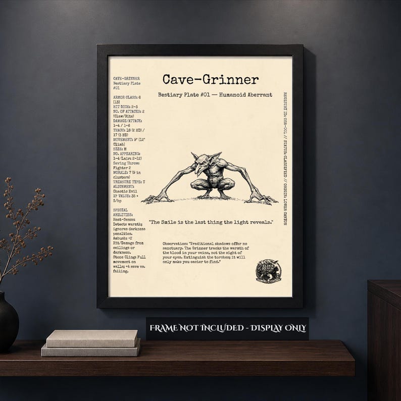 A dark, atmospheric room mockup showing the Cave-Grinner bestiary plate displayed in a black frame on a wooden shelf next to stacked books. The print features a vintage pen-and-ink monster illustration and tabletop RPG stat blocks. Text across the bottom clarifies 'Frame Not Included - Display Only'