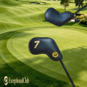 May include: Two black golf club head covers with gold accents are displayed against a green golf course background. One cover has the number 7 in gold, and the other has a gold logo. The ExceptionalClub logo is in the lower left corner.
