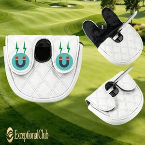 May include: A white mallet putter headcover featuring a quilted diamond pattern and a black interior lining. The cover displays two circular icons with a magnet graphic and green lightning bolts. The text ExceptionalClub is visible in the corner.