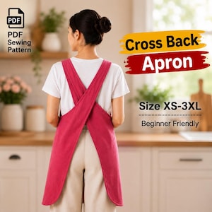 Pode incluir: Um molde de costura em PDF para um avental de costas cruzadas nos tamanhos XS-3XL. O avental é de cor rosa escuro sólido com alças largas que se cruzam nas costas. O texto na imagem diz: PDF Sewing Pattern, Cross Back Apron, Size XS-3XL, Beginner Friendly.