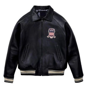 May include: Black leather bomber jacket with a zip-up front, collar, and ribbed cuffs and hem. Features a patch on the chest with the text "AVIREX" and an American flag design. The jacket has two front pockets.