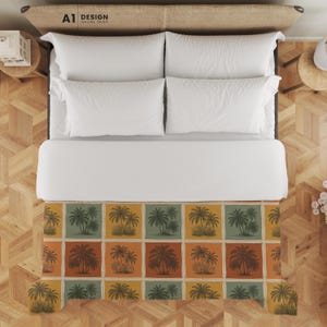 May include: An overhead shot of a bed with white bedding and a patterned throw. The throw has a repeating design of palm trees in orange, green, and yellow squares. The headboard is light brown, and the text "A1 DESIGN ONLINE SHOP" is visible.