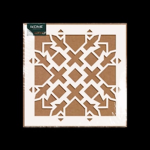 May include: A white stencil with a geometric pattern, packaged in clear plastic. The stencil features a repeating design of crosses, diamonds, and arrow-like shapes, set against a brown background. The package includes the brand name "IKONE".