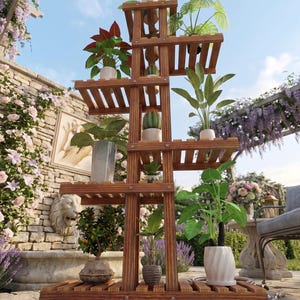 May include: A wooden plant stand with multiple tiers, displaying a collection of potted plants. The stand is constructed from stained wood and features a slatted design. The plants showcase diverse foliage, including green, red, and patterned leaves. The stand is positioned outdoors, with a stone wall and flowers visible.