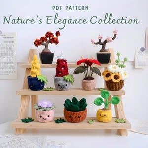 May include: A wooden shelf displays a collection of crocheted plants, including bonsai trees, flowering plants, and succulents. The plants are in various colors and styles, with smiling faces on the pots. The text "PDF PATTERN Nature's Elegance Collection" is at the top.