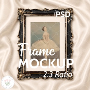May include: An ornate black and gold picture frame featuring a vintage ballerina print. The frame has decorative detailing and the text "Frame MOCKUP 2:3 Ratio". The image is set against a cream satin background.