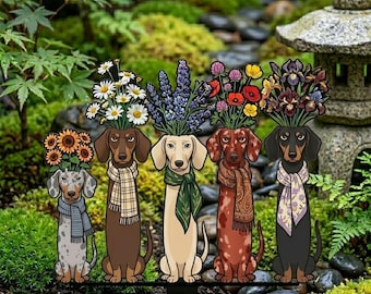 May include: A decorative garden stake featuring five dachshund dogs, each with a different color and pattern, wearing scarves and topped with a variety of colorful flowers. The dogs are arranged in a row against a backdrop of greenery.