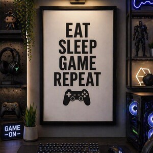 May include: A framed print with the words "EAT SLEEP GAME REPEAT" and a game controller icon. The image is part of a gaming setup, including a keyboard, mouse, and computer. Shelves display gaming accessories and decorative items.