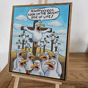 May include: A rectangular canvas painting in a wooden frame featuring a cartoon of multiple seagulls on wooden crosses against a blue sky with clouds. One central seagull has a speech bubble that reads, ALWAYyyyyyyyYS LOOK ON THE BRIGHT SIDE OF LIFE!
