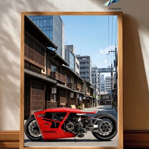 Peut inclure: Impression encadrée d'une moto rouge au design unique, sur fond de rue japonaise. La moto a un profil bas et des composants de moteur apparents. L'impression est dans un cadre en bois et est exposée sur un sol en bois.