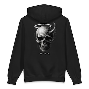 May include: Black hoodie with a detailed skull design, featuring a halo and a horn. The graphic is in grayscale, with the text "BE BOTH" below. The hoodie has a hood and long sleeves.