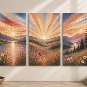 May include: A triptych wall art set featuring a continuous landscape painting of a sunrise over mountains, a lake, and a meadow filled with wildflowers. The color palette includes warm orange, yellow, purple, and blue tones across three vertical panels.