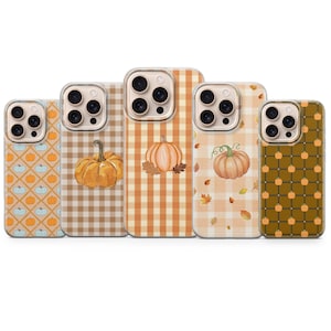 May include: Five smartphone cases arranged in a row, each featuring a unique autumn-themed design. The patterns include orange and light blue pumpkins on a diamond grid, a large orange pumpkin on a tan gingham background, and a dark green grid.