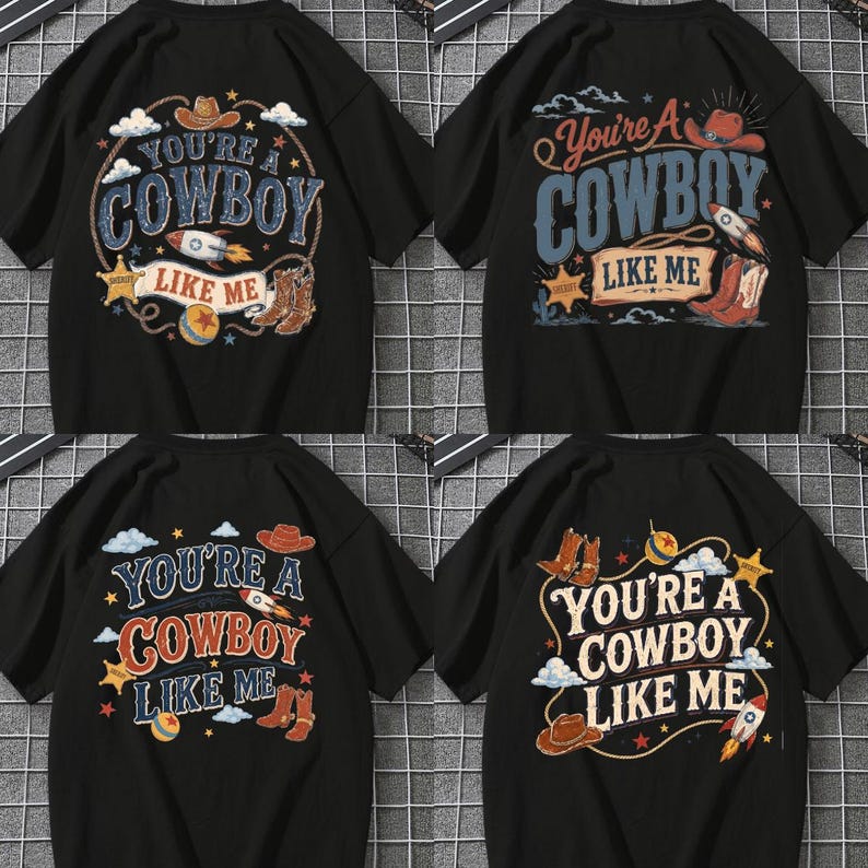 May include: A collection of four black short-sleeved t-shirts, each featuring a graphic print with the text "YOU'RE A COWBOY LIKE ME." The designs include illustrations of cowboy hats, boots, rockets, sheriff stars, and balls in various arrangements.