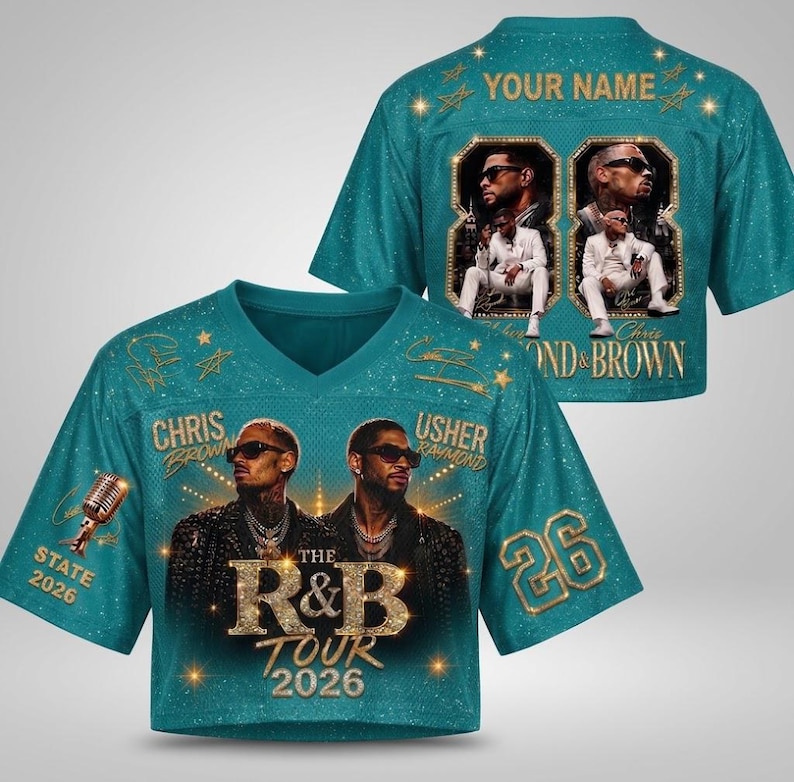 May include: A teal V-neck jersey featuring a graphic of Chris Brown and Usher, the text "THE R&B TOUR 2026", a microphone, and the number 26. The back displays "YOUR NAME" and two framed photos of the artists with the text "CHRIS BROWN & BROWN".