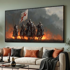 Peut inclure: Une impression murale rectangulaire représentant un groupe de quatre chevaliers en armure à cheval chevauchant à travers les flammes. Le chevalier central porte un drapeau blanc avec une croix rouge. Le ciel est sombre et nuageux.